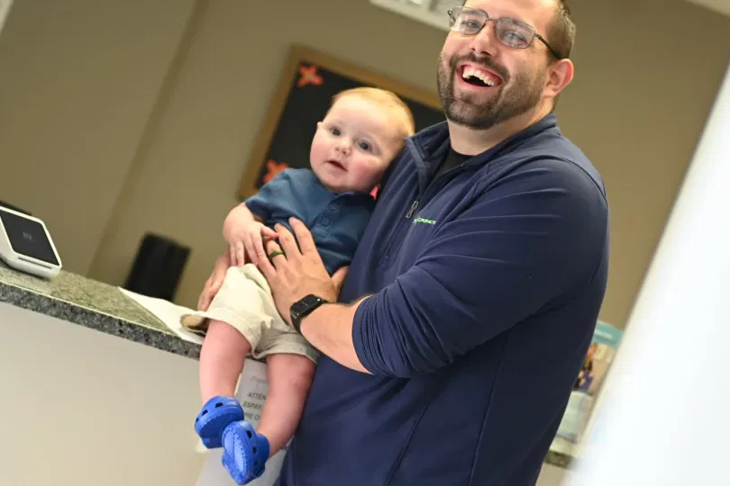 Family chiropractic care - Doctor with baby patient